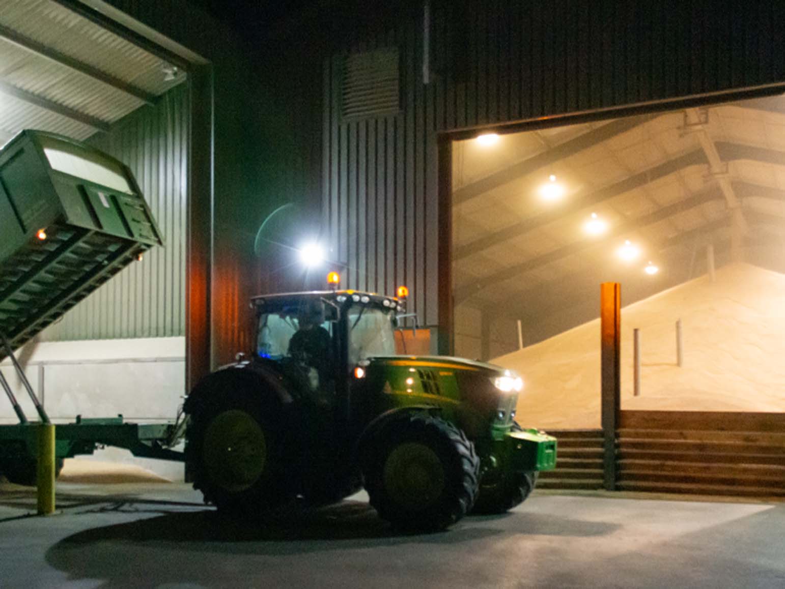 Bulwick Storage Facility - Nightime harvest, tipping wheat into the pit for automated handling to the dryer and bulk storage shed.