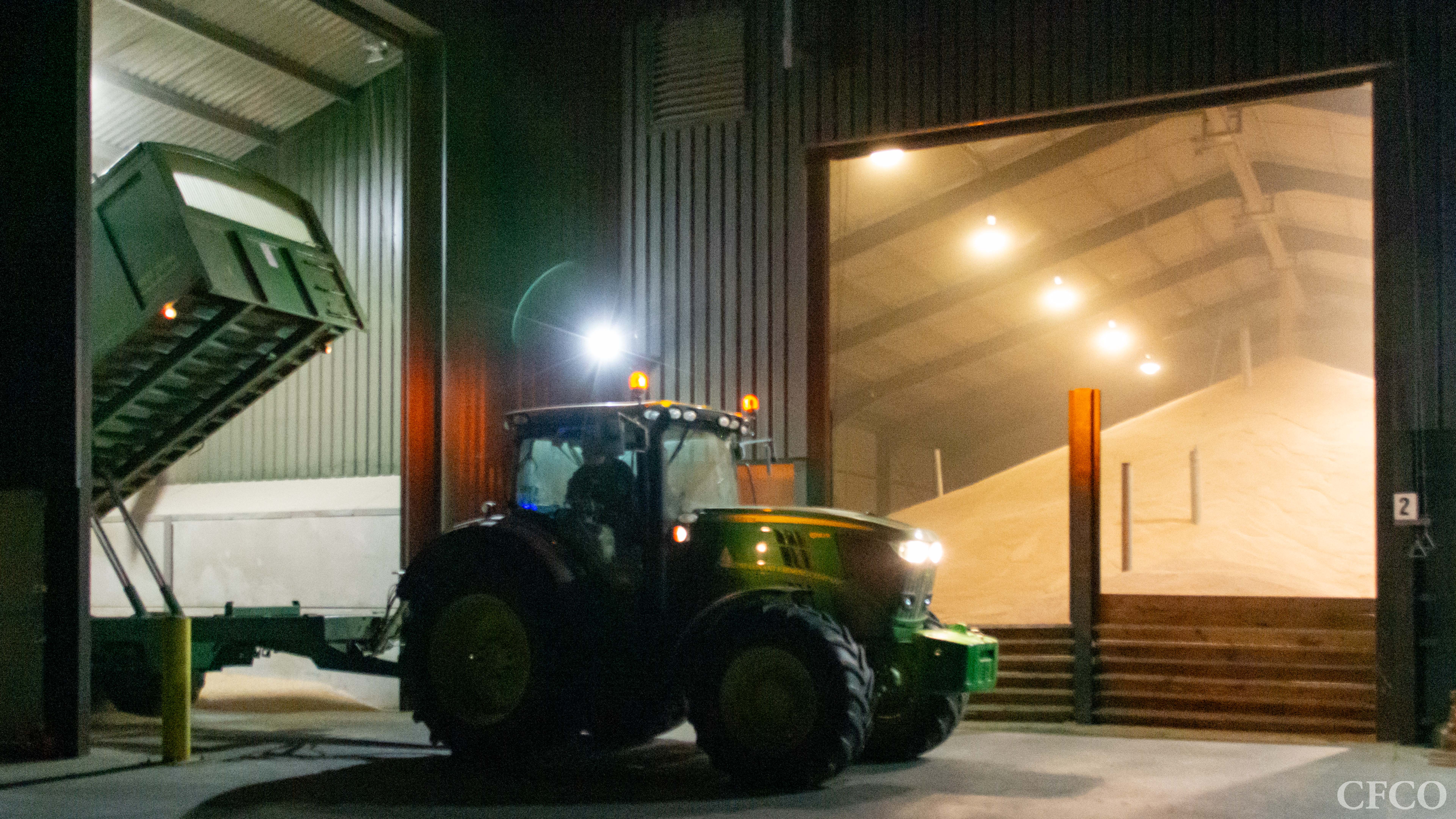 Bulwick Storage Facility - Nightime harvest, tipping wheat into the pit for automated handling to the dryer and bulk storage shed.