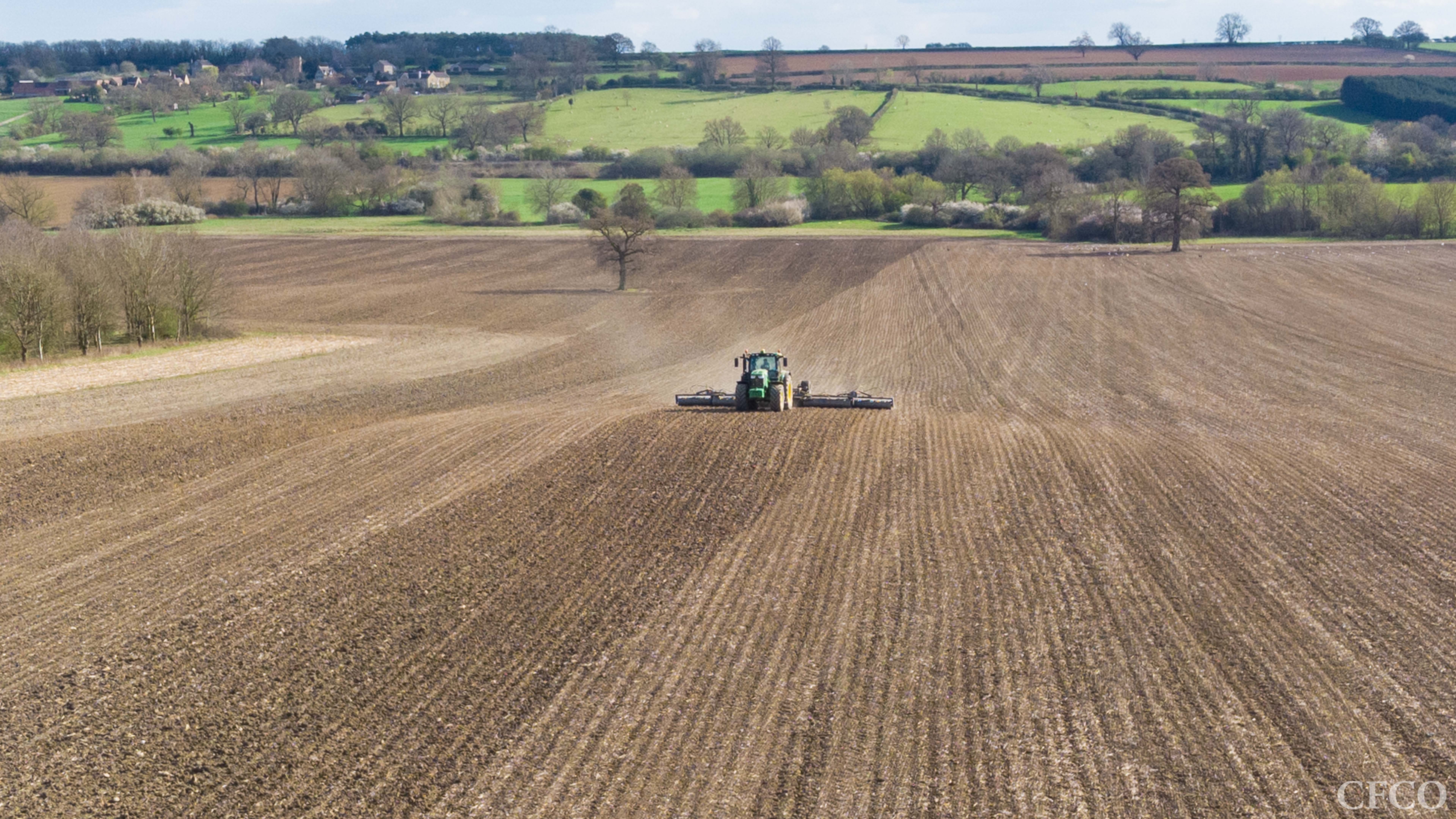 John Deere 6215 & 12m Dalbo Rolls - GPS guided consolidation of a strip-till drilled field (note the ridges).