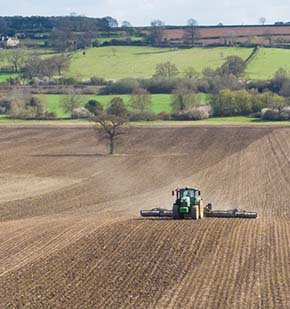 John Deere 6215 & 12m Dalbo Rolls - GPS guided consolidation of a strip-till drilled field (note the ridges).