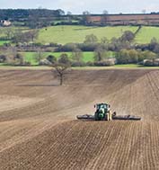 John Deere 6215 & 12m Dalbo Rolls - GPS guided consolidation of a strip-till drilled field (note the ridges).