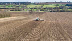 John Deere 6215 & 12m Dalbo Rolls - GPS guided consolidation of a strip-till drilled field (note the ridges).