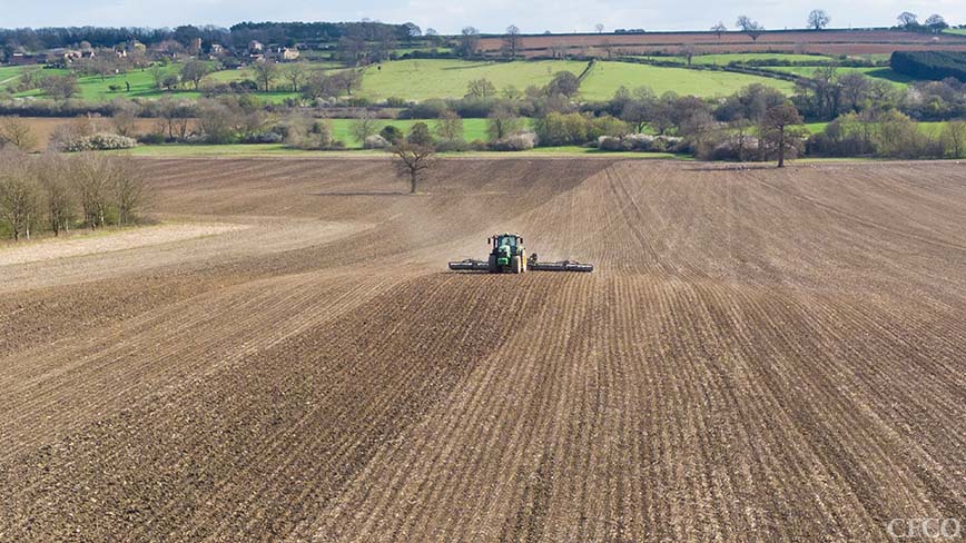 John Deere 6215 & 12m Dalbo Rolls - GPS guided consolidation of a strip-till drilled field (note the ridges).