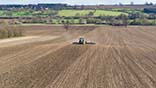 John Deere 6215 & 12m Dalbo Rolls - GPS guided consolidation of a strip-till drilled field (note the ridges).